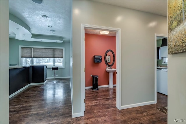 hallway featuring dark hardwood / wood-style flooring