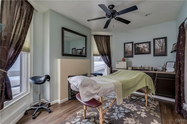 bedroom featuring dark wood-type flooring and ceiling fan