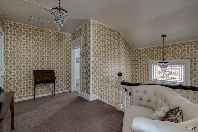 sitting room featuring lofted ceiling, a notable chandelier, crown molding, and carpet