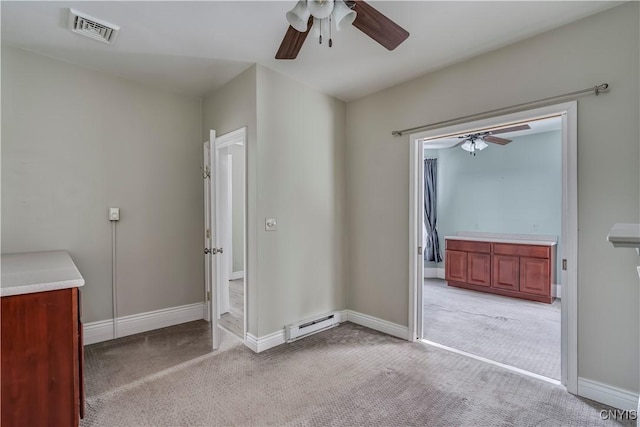 unfurnished bedroom featuring ceiling fan, light colored carpet, and a baseboard radiator