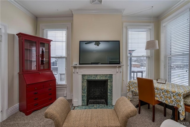 living room with crown molding and a high end fireplace