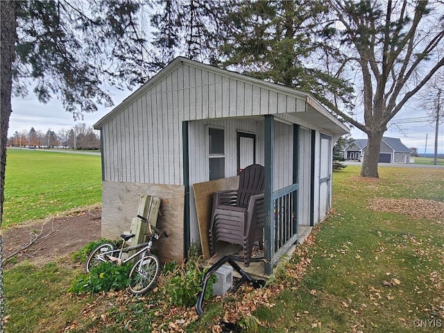 view of outdoor structure with a lawn