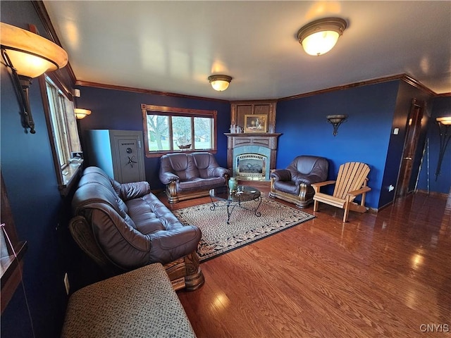 living room with crown molding and dark hardwood / wood-style flooring