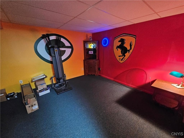 workout room featuring a paneled ceiling