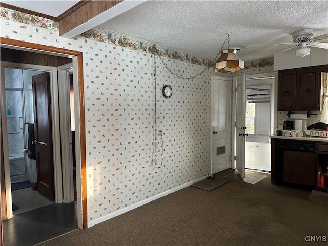 kitchen with beamed ceiling, ceiling fan, dark carpet, dark brown cabinets, and a textured ceiling