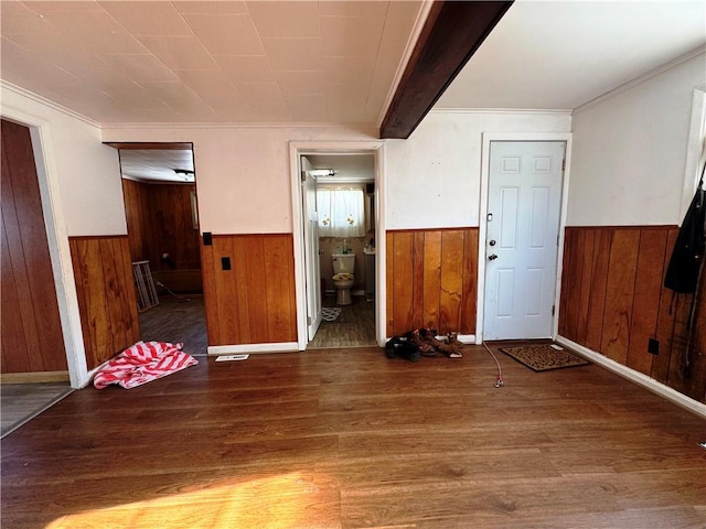 interior space with hardwood / wood-style floors and crown molding