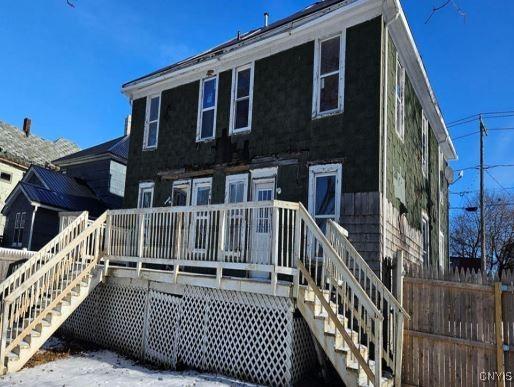 rear view of house featuring a deck