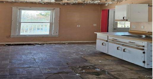 kitchen featuring sink and white cabinets