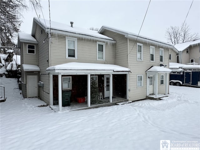 view of snow covered house