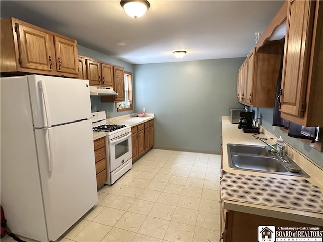 kitchen with white appliances and sink