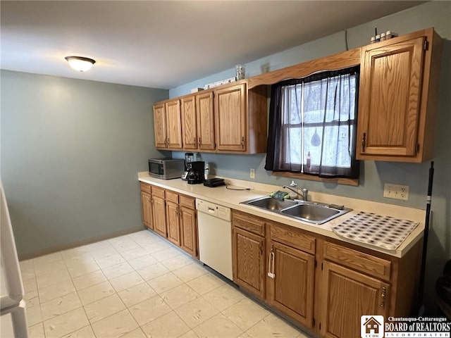 kitchen featuring dishwasher and sink