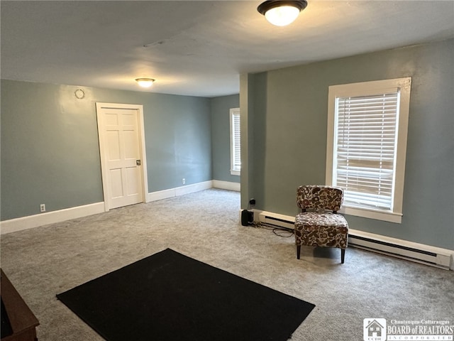 sitting room featuring carpet flooring