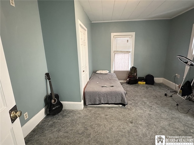 carpeted bedroom featuring crown molding