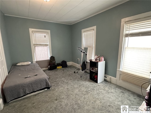 bedroom featuring a baseboard heating unit, ornamental molding, and carpet flooring