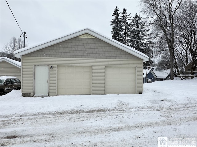 view of snow covered garage