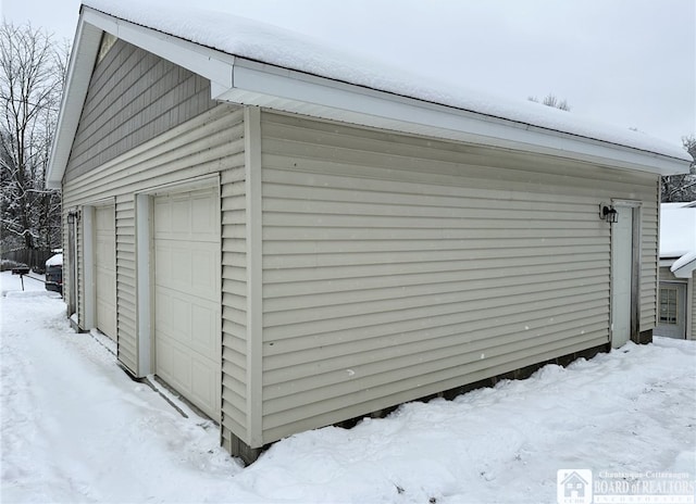 view of snow covered garage