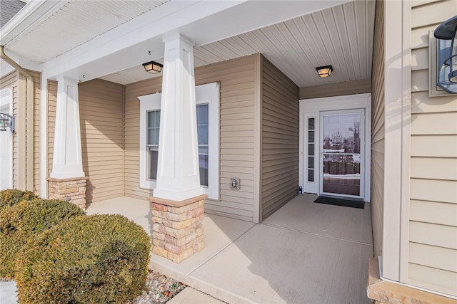 doorway to property featuring a porch