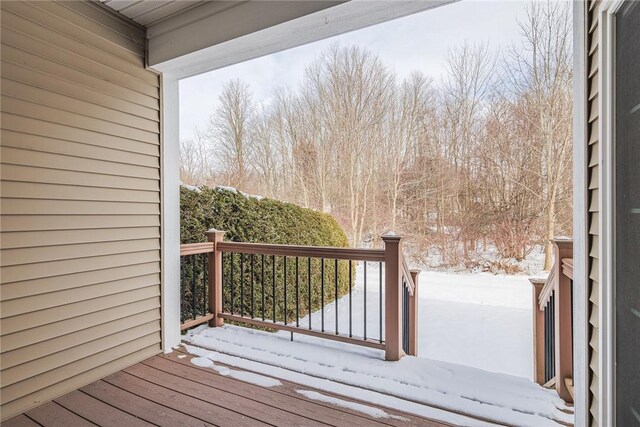 view of snow covered deck