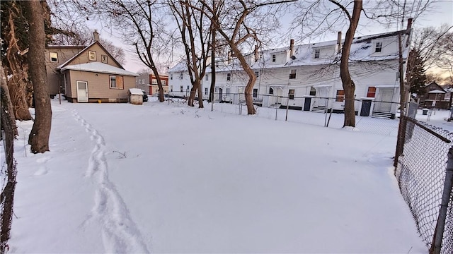 view of yard layered in snow