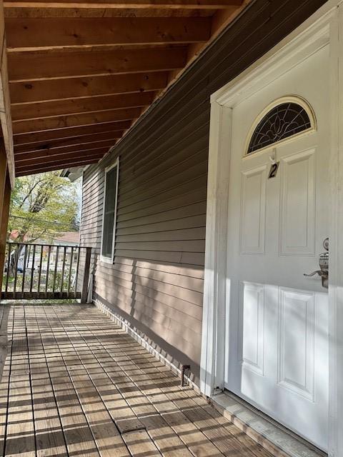 doorway to property featuring covered porch