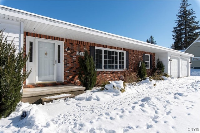 single story home featuring a garage