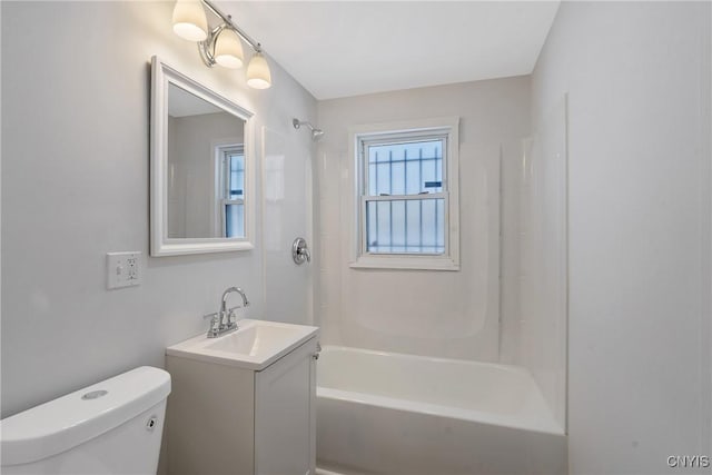 full bathroom with vanity, tub / shower combination, and toilet