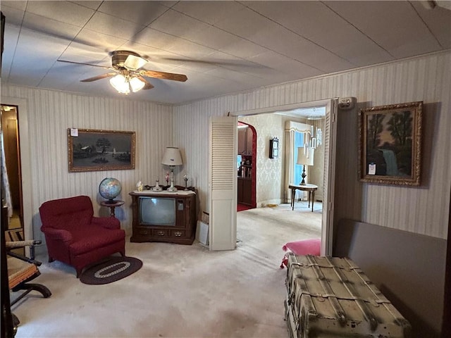 sitting room with ceiling fan and carpet floors