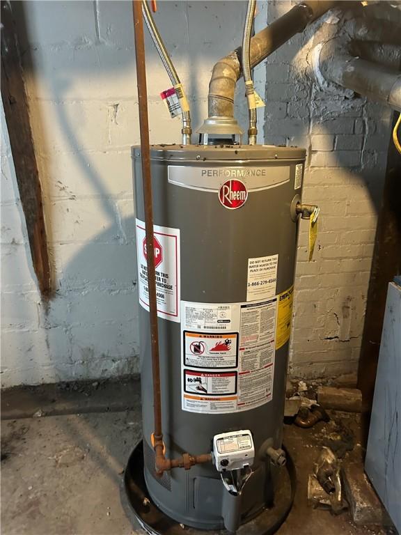 utility room featuring gas water heater