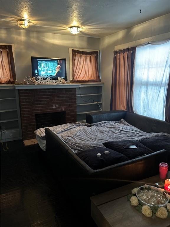 bedroom featuring a fireplace