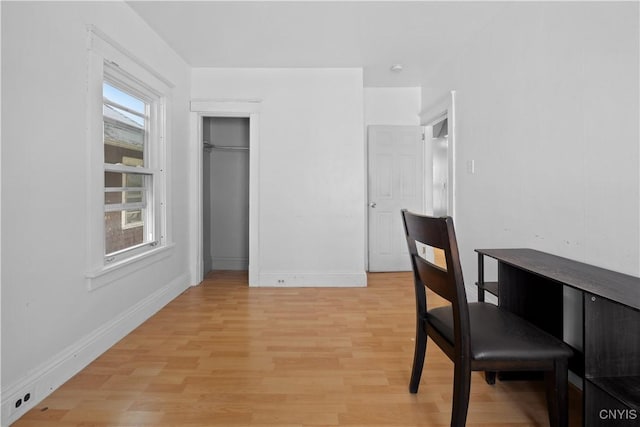 office space with a healthy amount of sunlight and light wood-type flooring