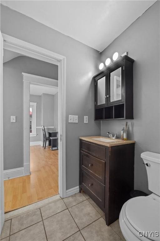 bathroom with vanity, tile patterned floors, and toilet