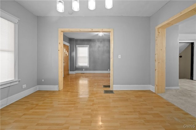 unfurnished room featuring light hardwood / wood-style floors