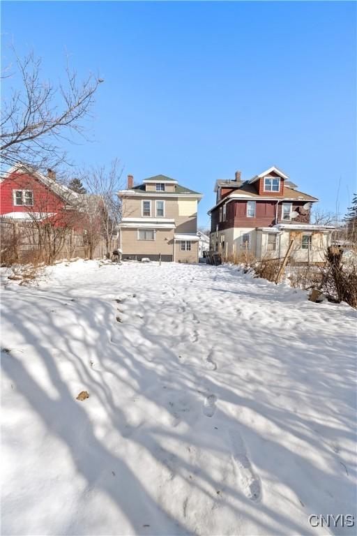 view of yard covered in snow