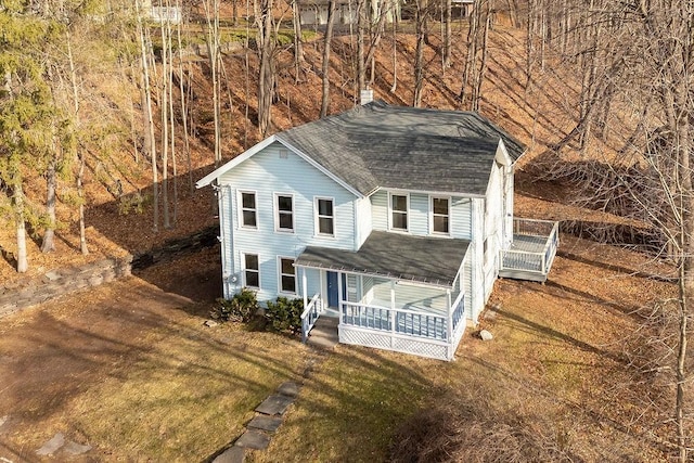 view of front facade with a porch and a front lawn