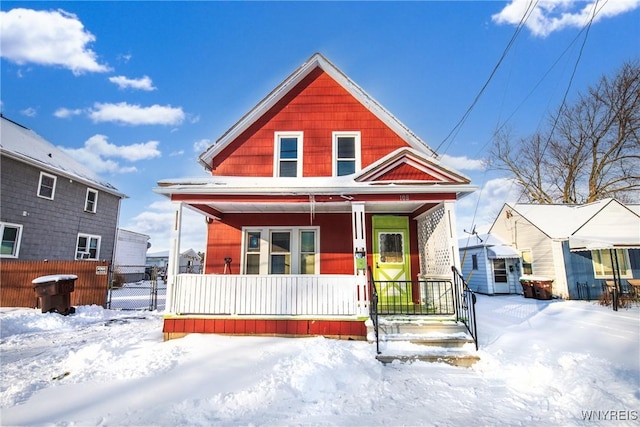 view of front of property with a storage shed and covered porch