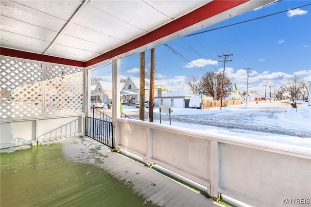 view of snow covered deck