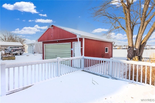 view of snow covered garage