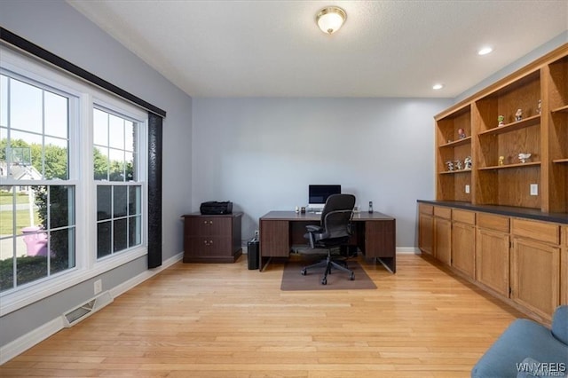 home office with light wood-type flooring