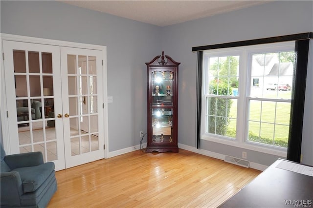 doorway featuring hardwood / wood-style flooring and french doors