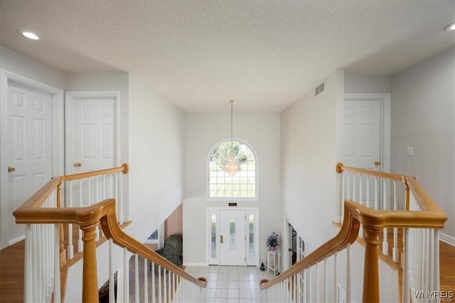 foyer entrance featuring a textured ceiling