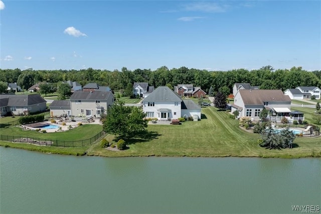 birds eye view of property with a water view