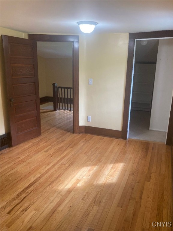 empty room with light wood-type flooring