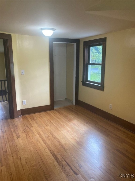 spare room with hardwood / wood-style flooring