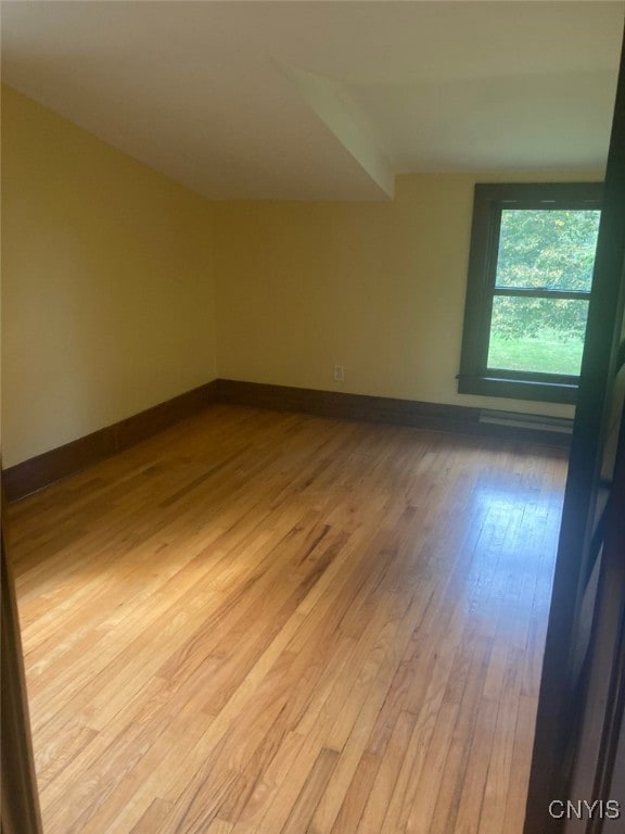 spare room with light hardwood / wood-style floors