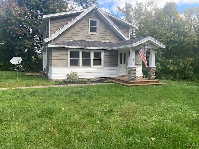 view of front facade with a porch and a front yard