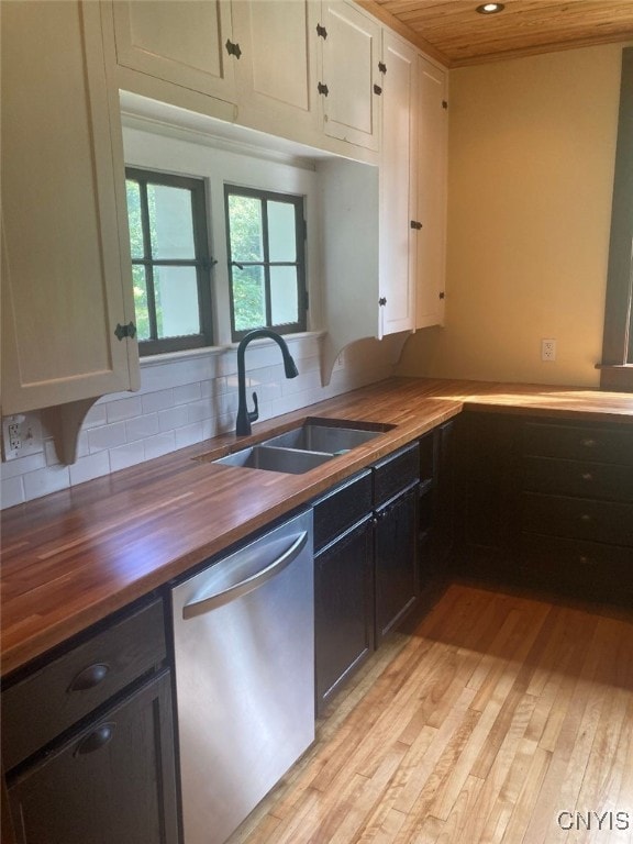 kitchen featuring wood counters, sink, wooden ceiling, dishwasher, and white cabinets