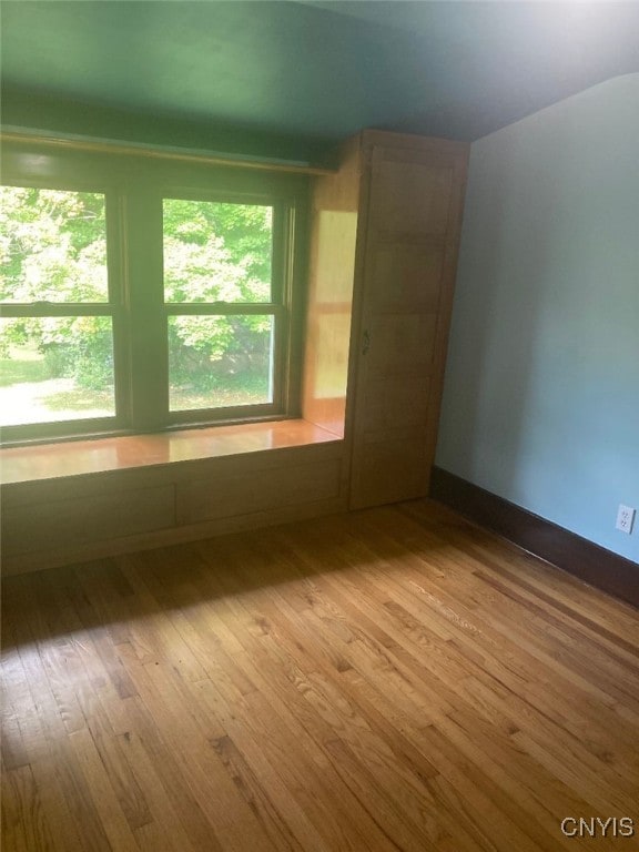 spare room featuring hardwood / wood-style floors