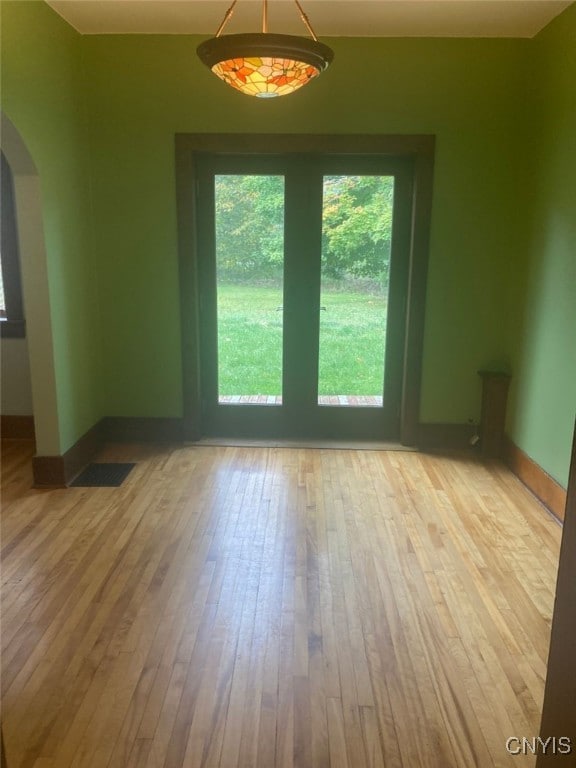 spare room with light hardwood / wood-style flooring