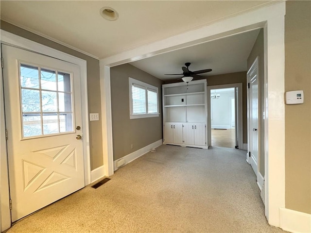 doorway with ceiling fan