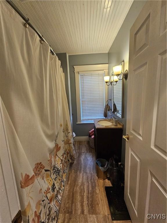 bathroom with hardwood / wood-style flooring and vanity